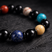 Close-up of the natural gemstone beads and black spacer rings
