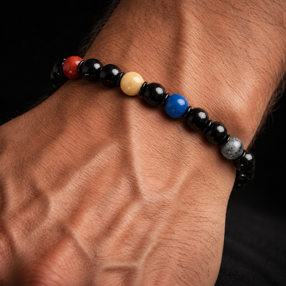 Cosbita Solar System Bracelet worn on a man's wrist